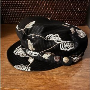 Satin finish Goorin newsboy cap with floral pattern